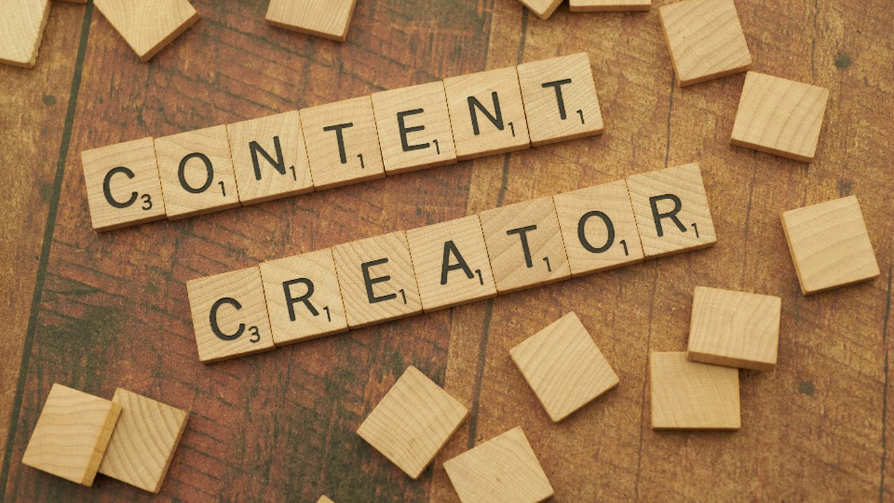 Scrabble tiles spelling Content Creator, illustrating online reputation management trends